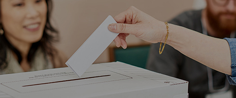 Hand with ballot